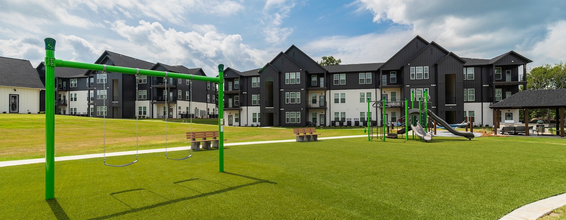 a playground in front of buildings