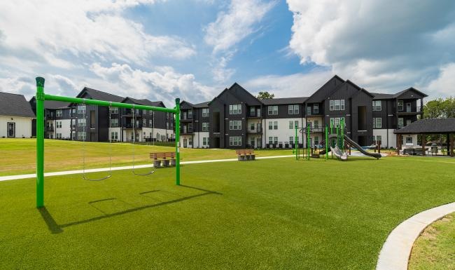 a playground in front of buildings